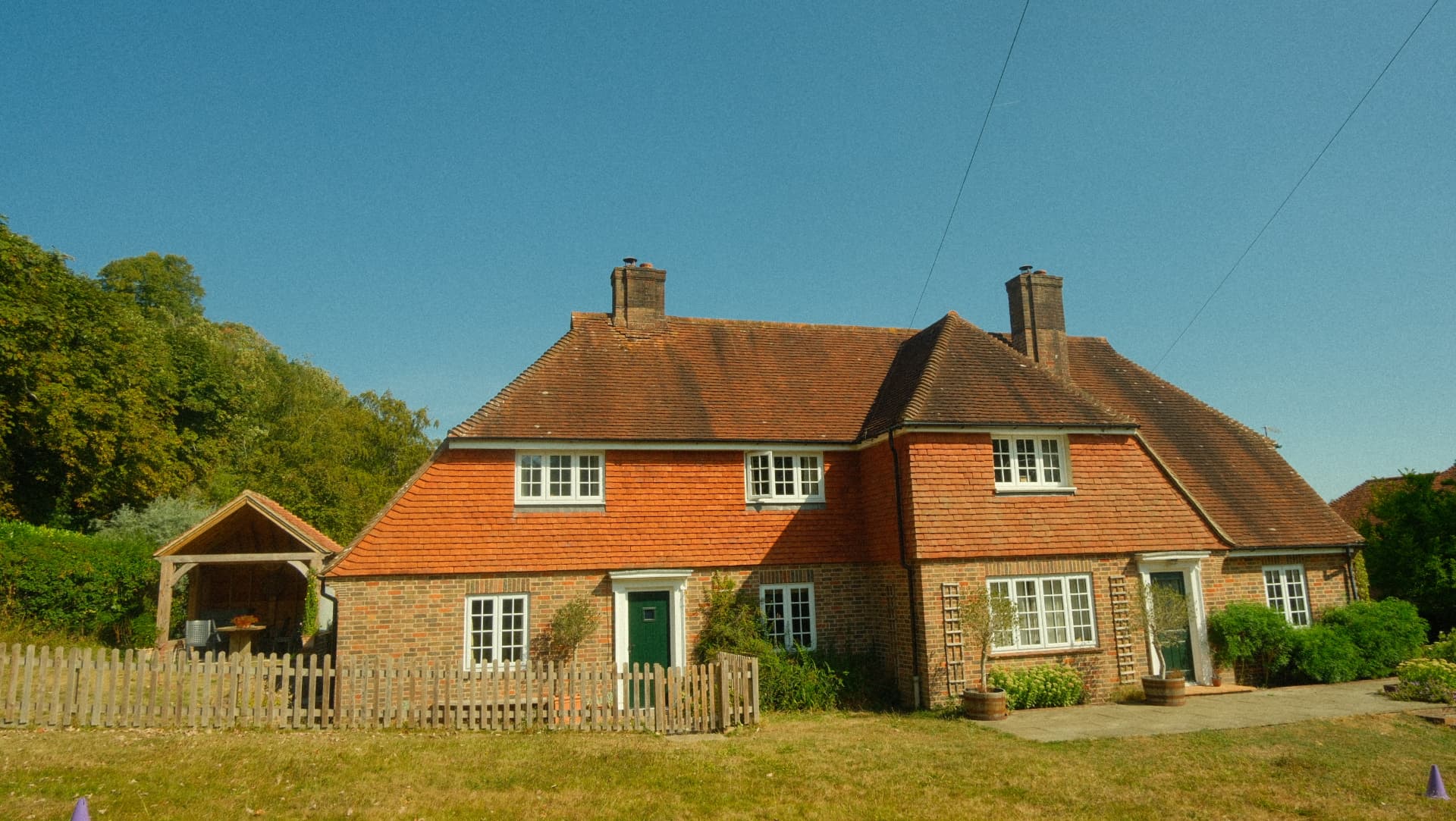 A traditional English flint cottage on the South Downs at golden hour